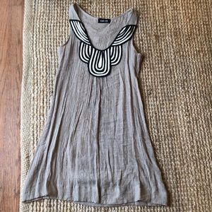 Tan with black and white sleeveless dress